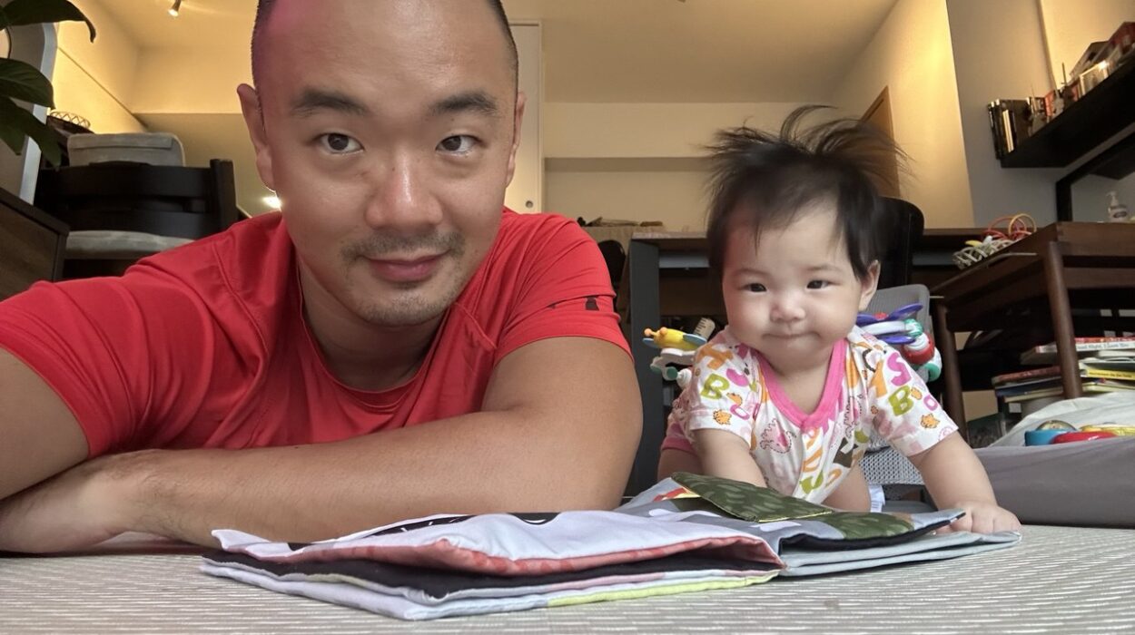 Clement at home with his baby daughter